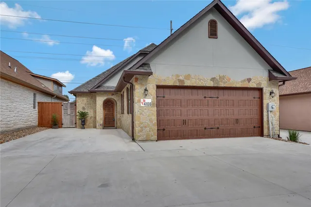 a view of a house with a garage