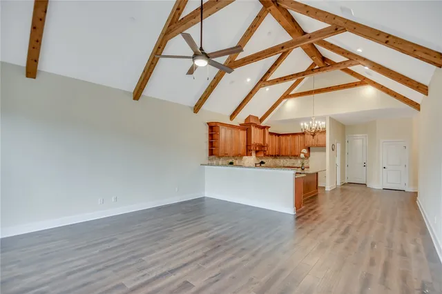 a view of a room with wooden floor and cabinet