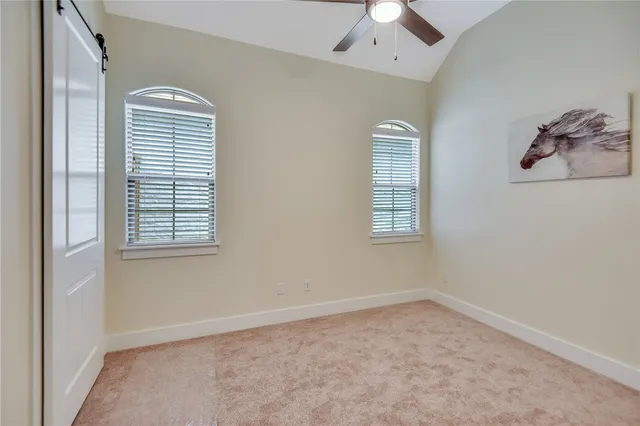 a bathroom with a granite countertop tub sink toilet mirror and shower