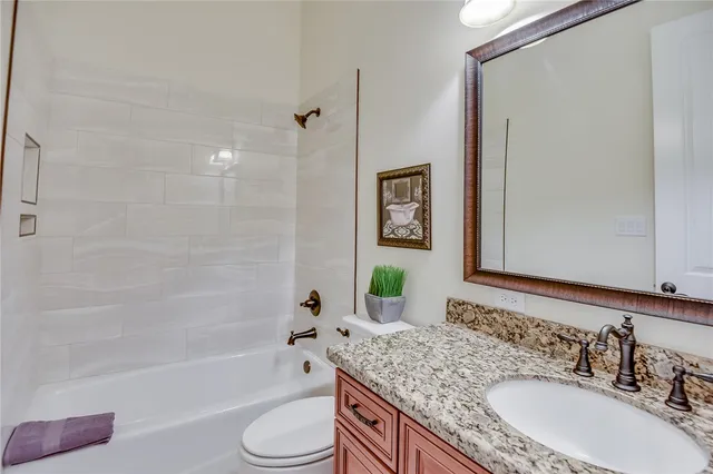 a view of a hallway with wooden floor and entryway