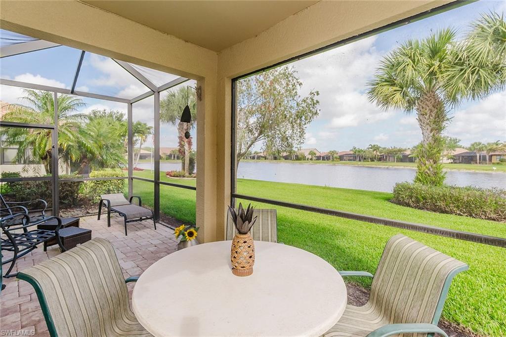 a view of an outdoor dining space with furniture and garden