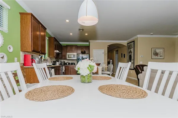 a living room with furniture ceiling fan and a rug