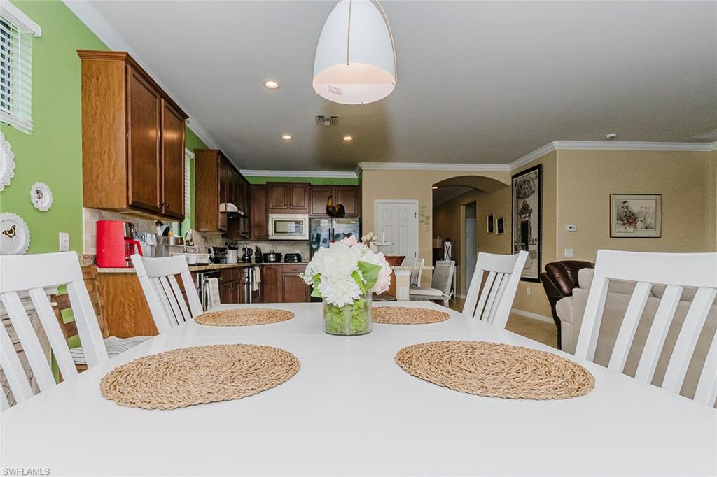 6441 Liberty Street Ave Maria, FL 34142 - Photo 21 of 48 a view of a dining room with furniture