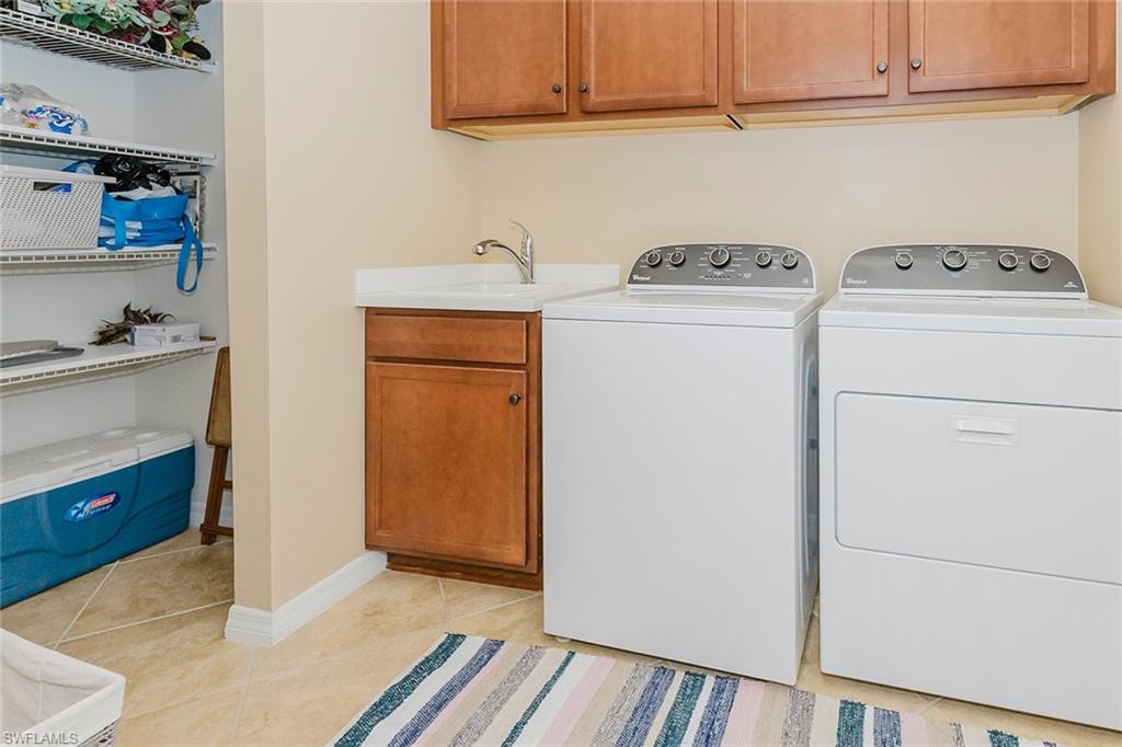 6441 Liberty Street Ave Maria, FL 34142 - Photo 29 of 48 a utility room with dryer and washer