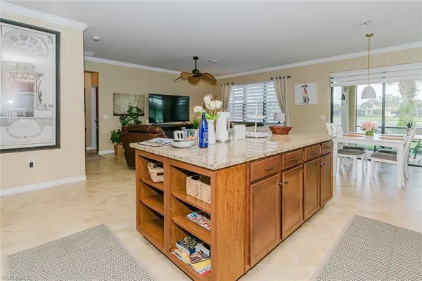 a view of a patio with a table chairs and a backyard