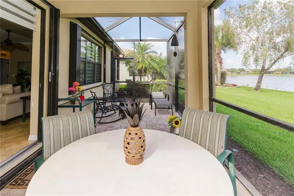 a living room with furniture and garden view