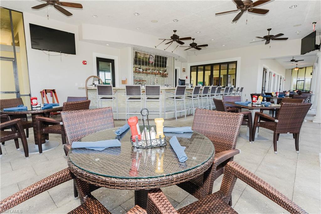 6441 Liberty Street Ave Maria, FL 34142 - Photo 45 of 48 a living room with dining room and wooden floor