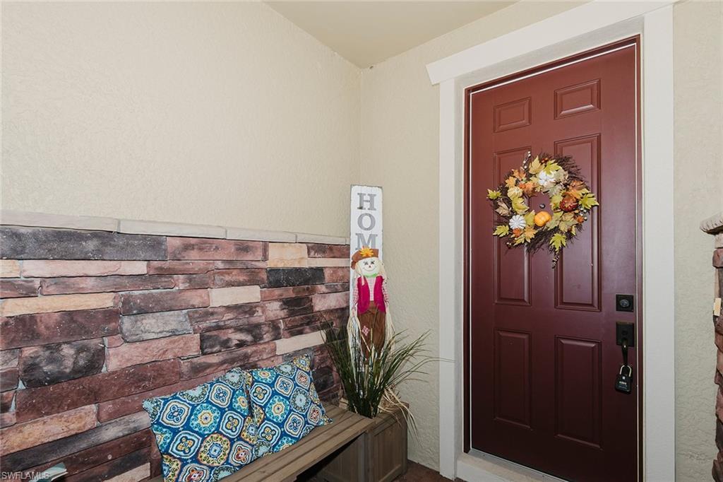 6441 Liberty Street Ave Maria, FL 34142 - Photo 6 of 48 a view of entryway with wooden floor