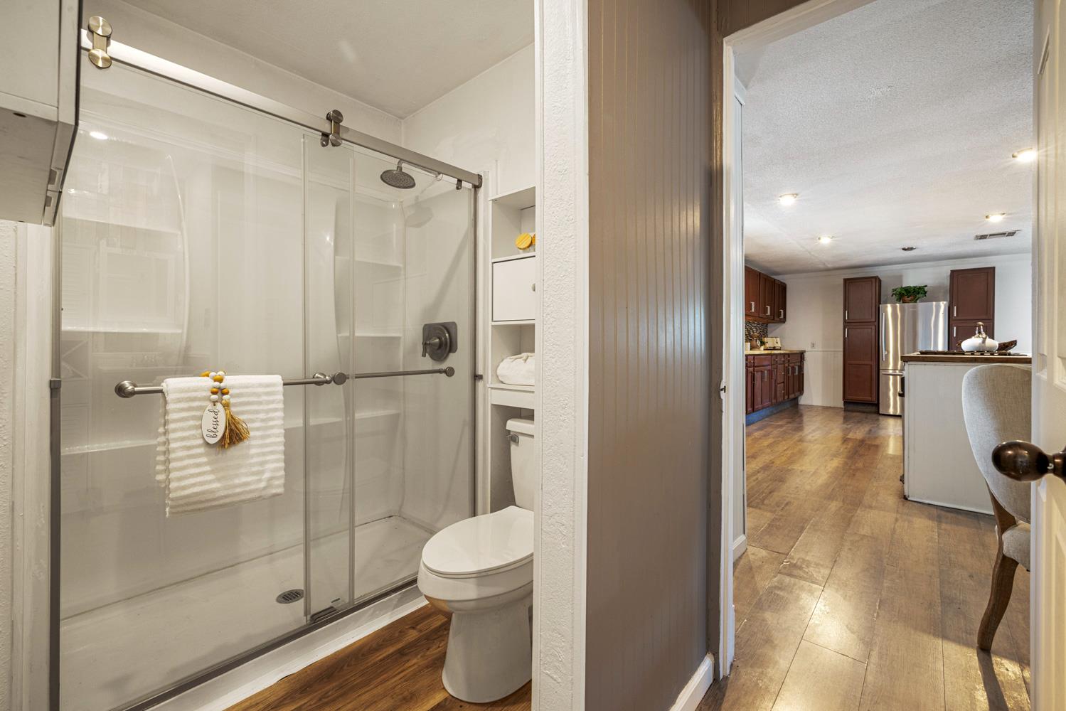 2621 Prescott Road, Unit 79 Modesto, CA 95350 - Photo 27 of 41 a bathroom with a shower and a toilet