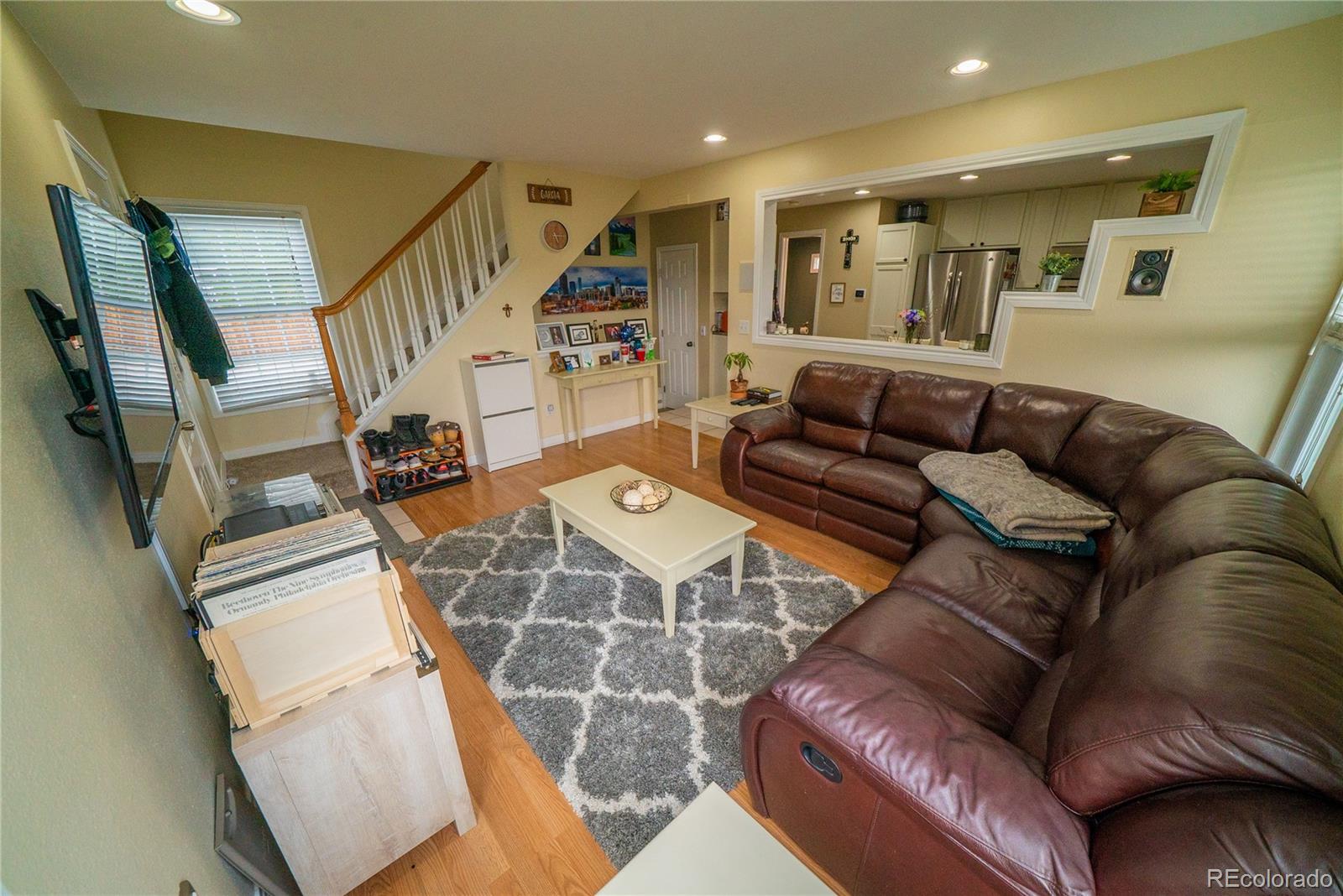 622 Longfellow Lane Highlands Ranch, CO 80126 - Photo 11 of 24 a living room with furniture and wooden floor