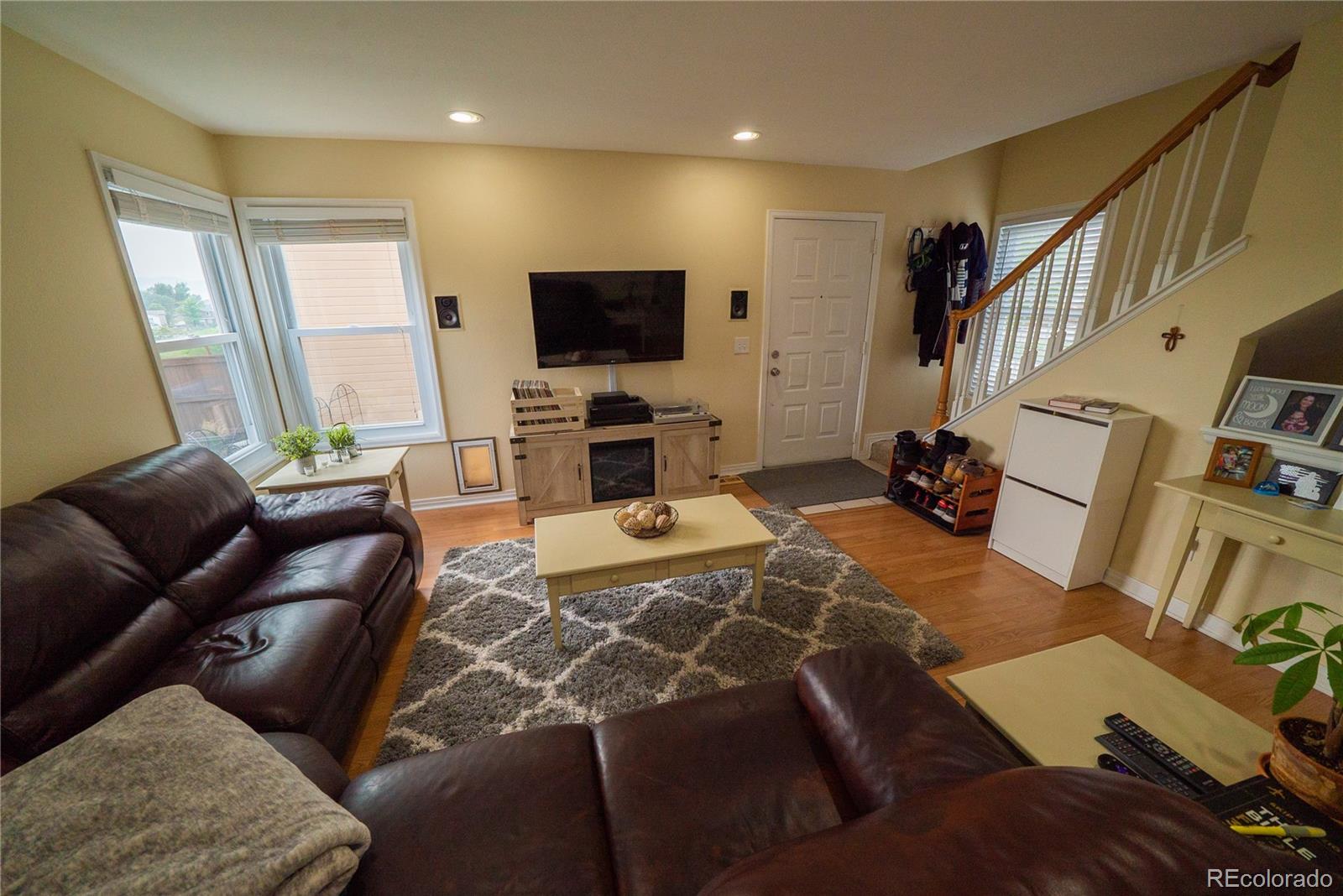 622 Longfellow Lane Highlands Ranch, CO 80126 - Photo 12 of 24 a living room with furniture and a flat screen tv