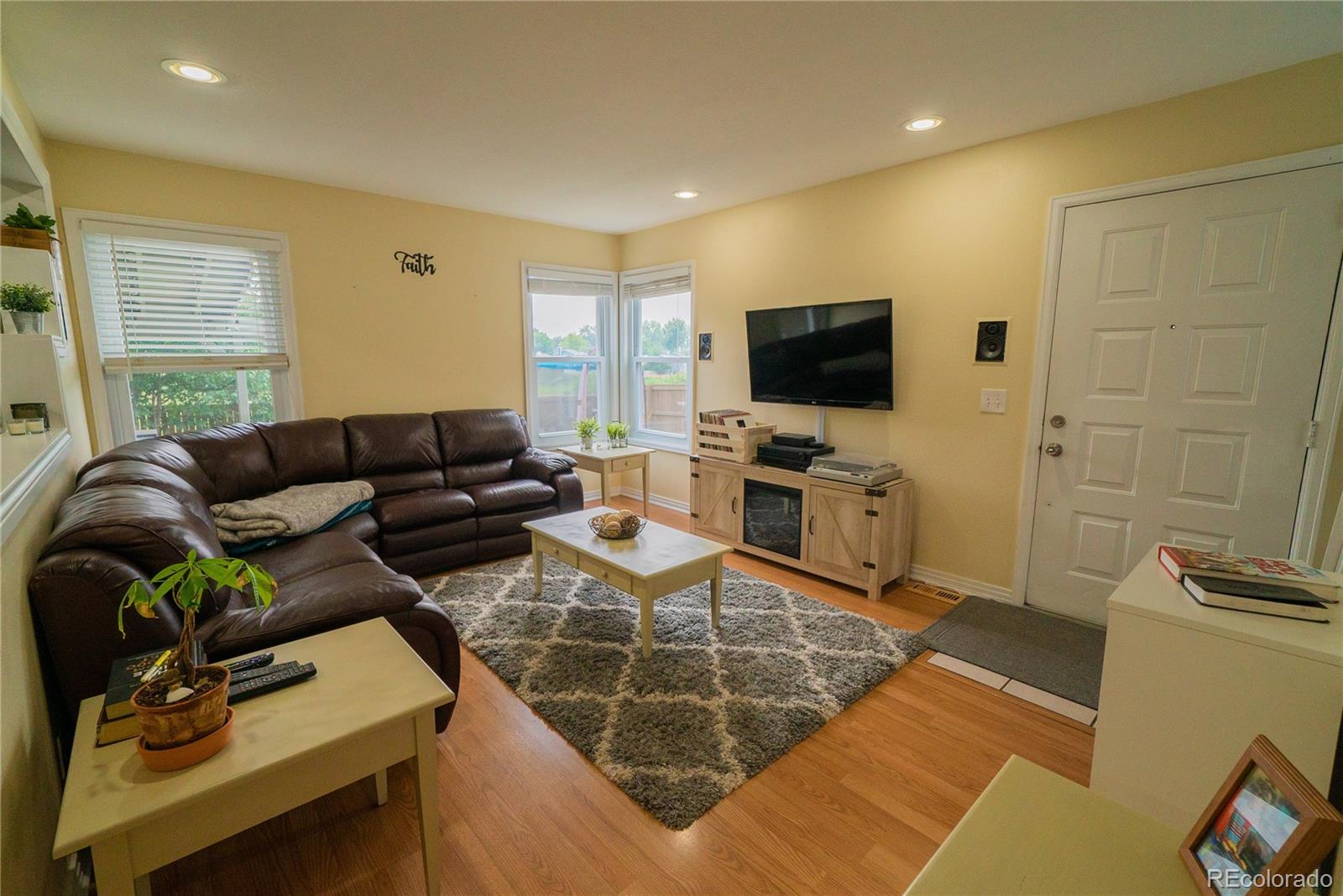 622 Longfellow Lane Highlands Ranch, CO 80126 - Photo 13 of 24 a living room with furniture and a flat screen tv