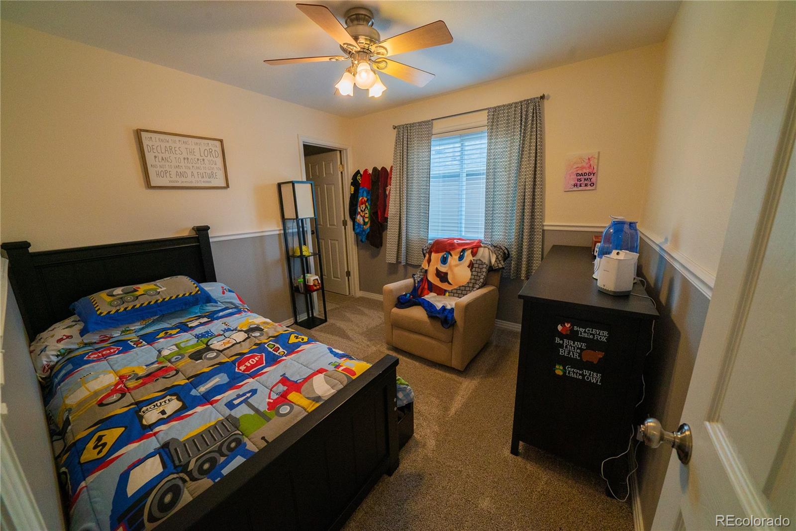622 Longfellow Lane Highlands Ranch, CO 80126 - Photo 19 of 24 a bedroom with a bed and a tv
