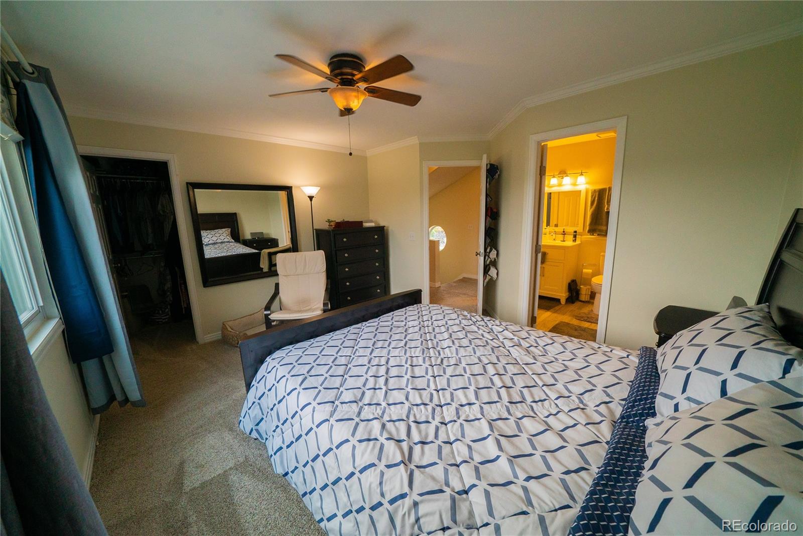 622 Longfellow Lane Highlands Ranch, CO 80126 - Photo 20 of 24 a bedroom with a bed and wooden floor