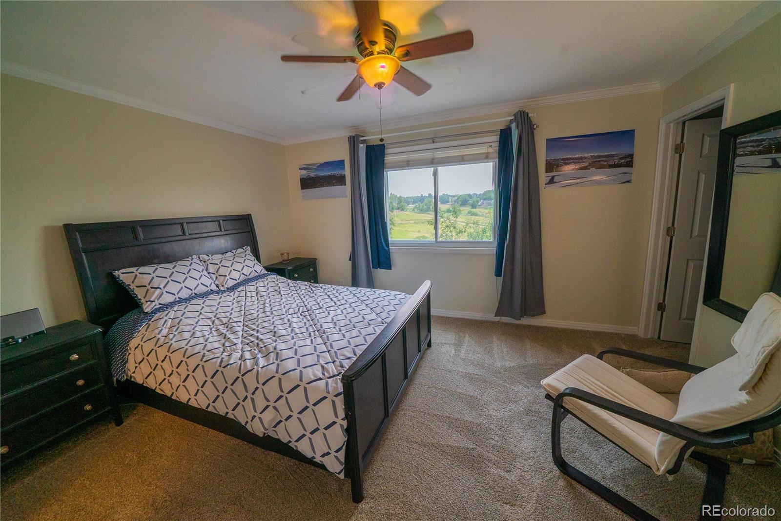 622 Longfellow Lane Highlands Ranch, CO 80126 - Photo 22 of 24 a bed sitting in a room next to a window