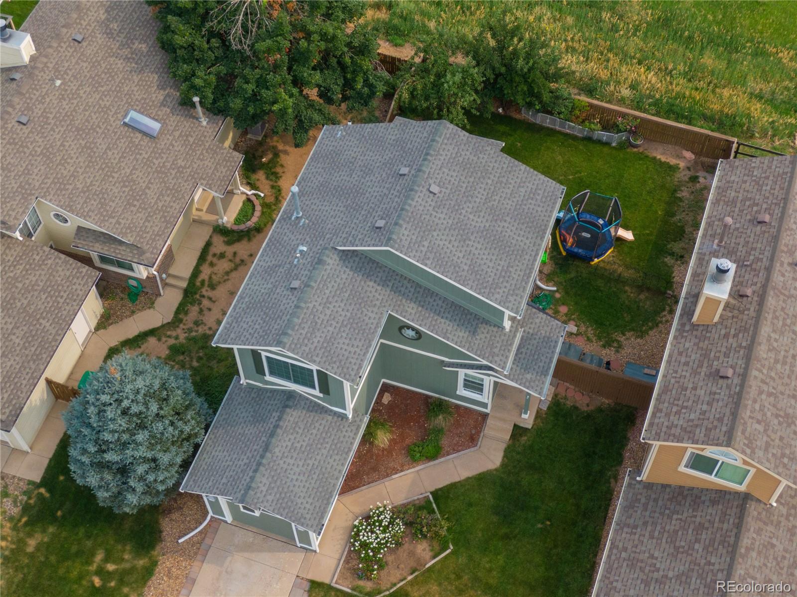 622 Longfellow Lane Highlands Ranch, CO 80126 - Photo 5 of 24 an aerial view of a house with a yard and pool