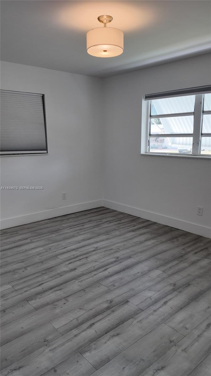 2100 North 57th Way Hollywood, FL 33021 - Photo 18 of 47 a view of a room with wooden floor and a window