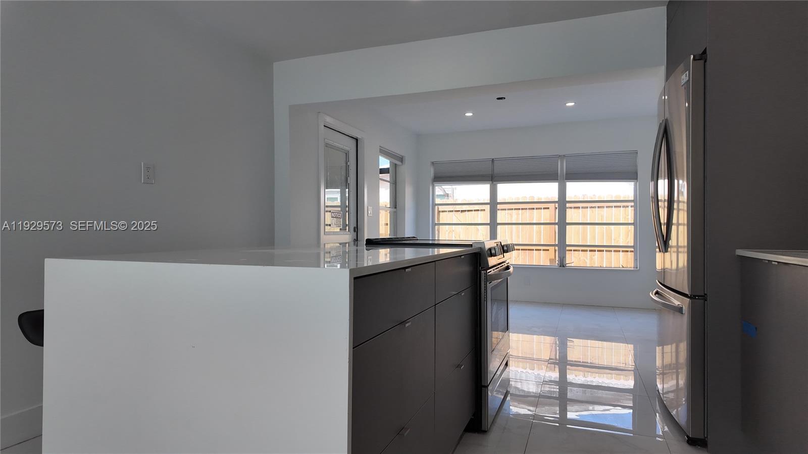 2100 North 57th Way Hollywood, FL 33021 - Photo 9 of 47 a kitchen with a large window