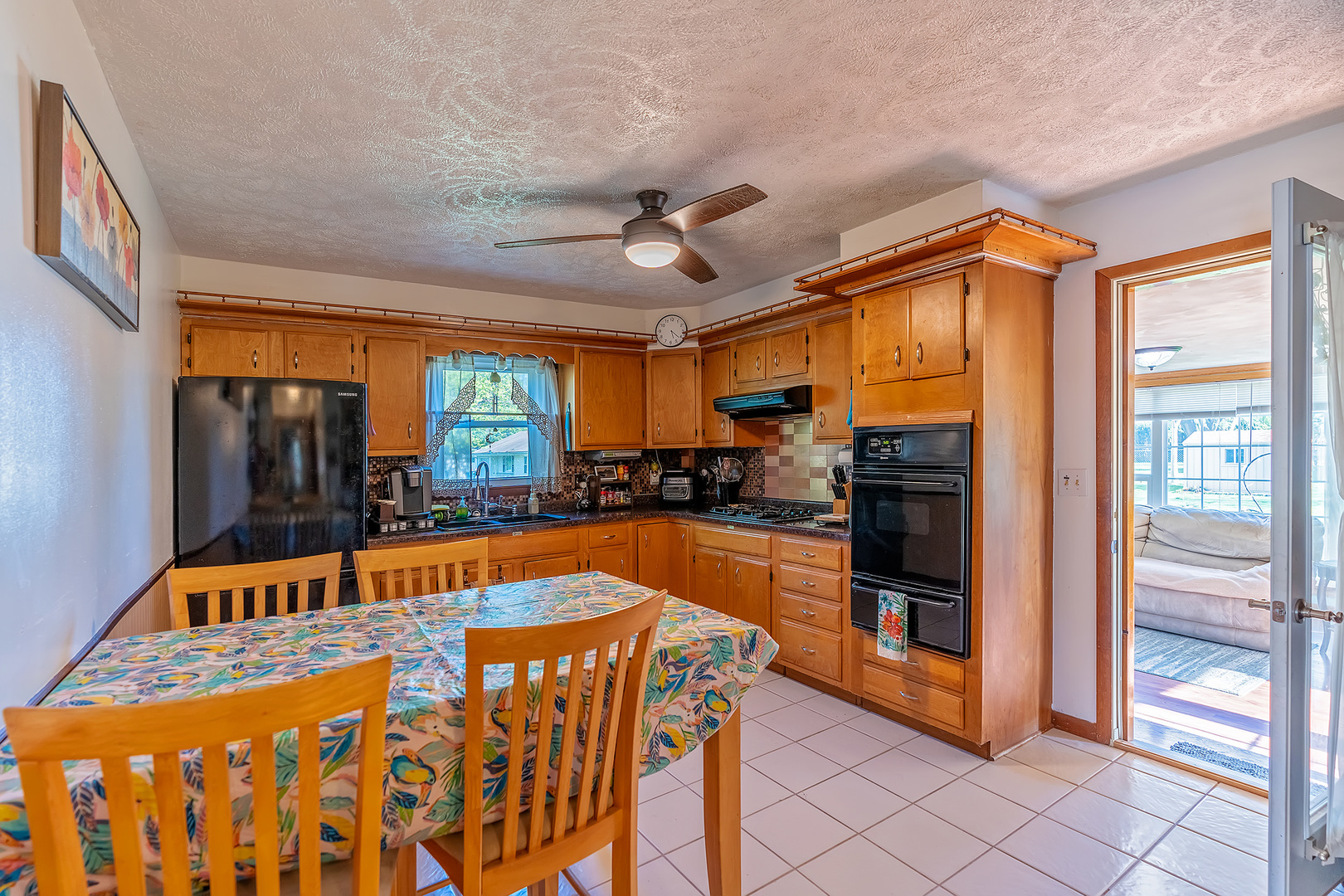 902 Warren Street Chenoa, IL 61726 - Photo 13 of 36 a dining hall with stainless steel appliances granite countertop a refrigerator and a stove