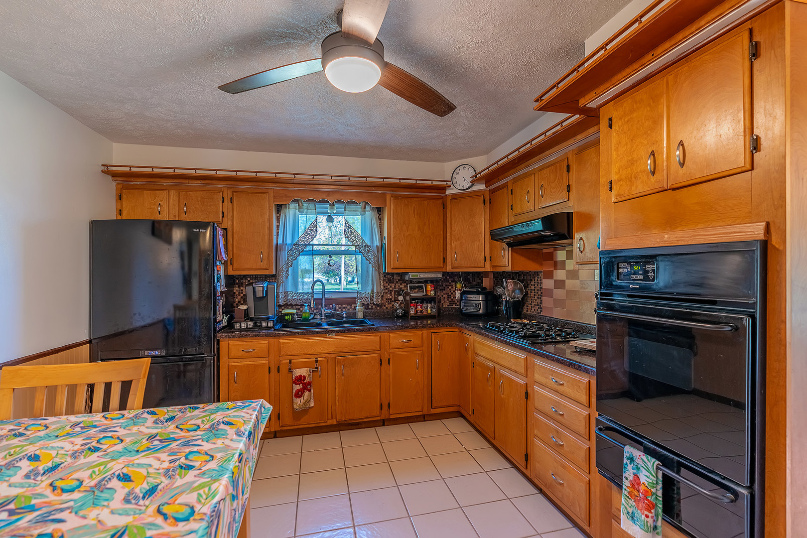 902 Warren Street Chenoa, IL 61726 - Photo 14 of 36 a kitchen with stainless steel appliances granite countertop a sink stove and refrigerator