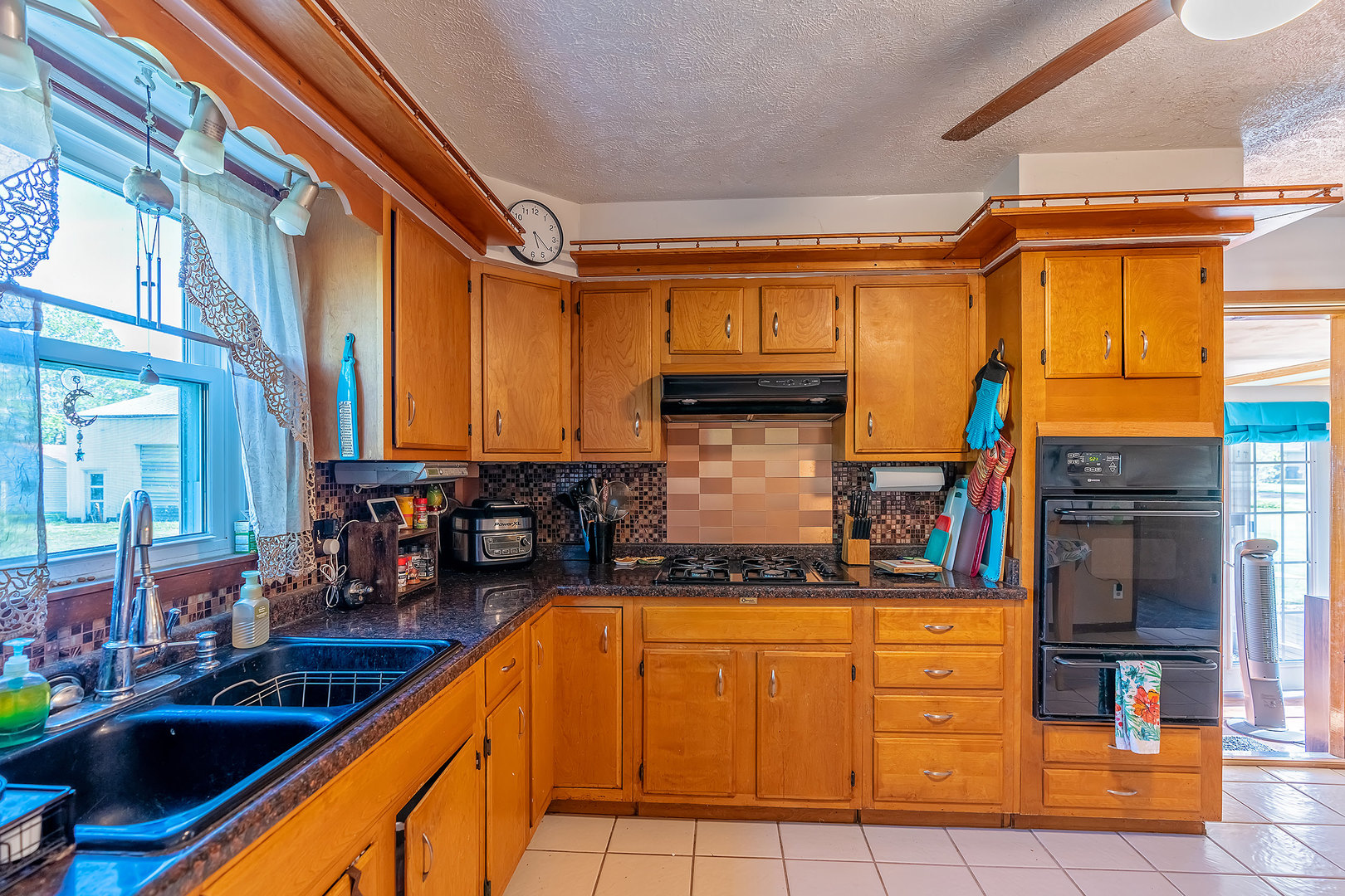 902 Warren Street Chenoa, IL 61726 - Photo 16 of 36 a view of a kitchen with a sink and cabinets