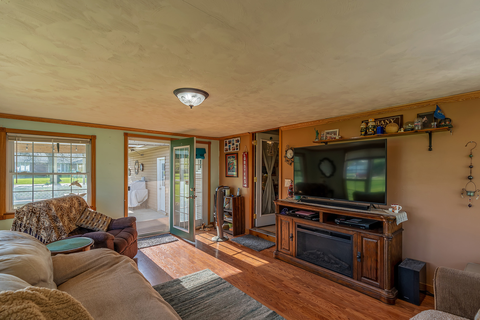 902 Warren Street Chenoa, IL 61726 - Photo 21 of 36 a living room with furniture and a flat screen tv