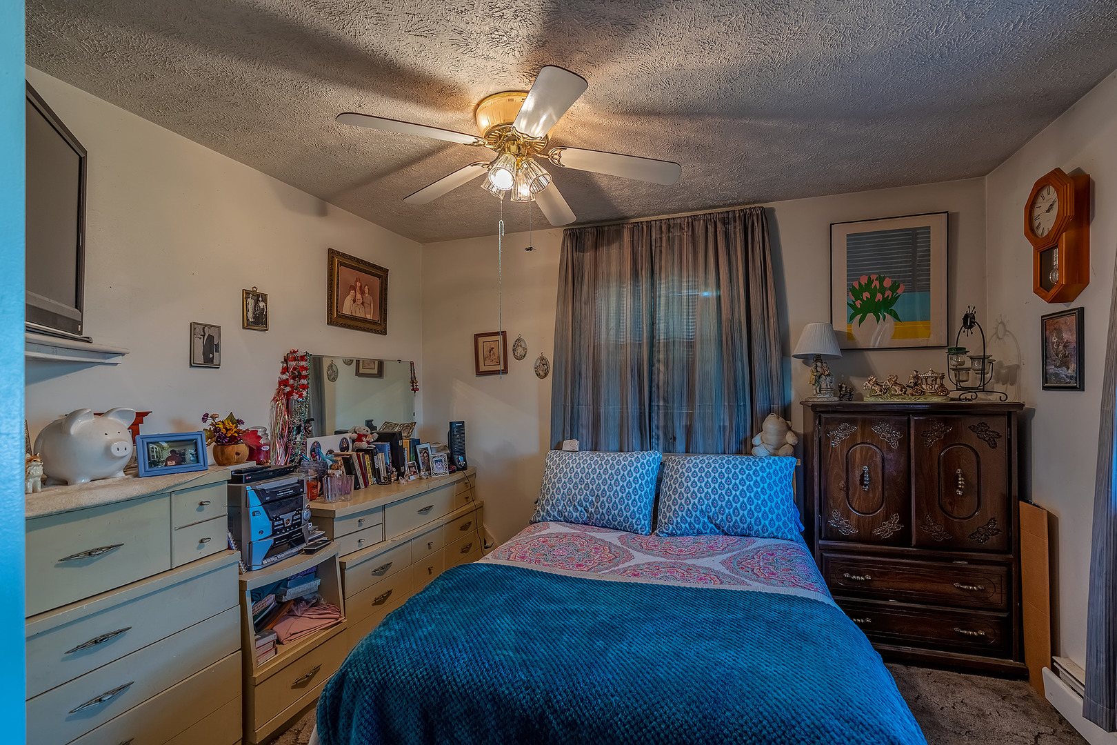 902 Warren Street Chenoa, IL 61726 - Photo 35 of 36 a bedroom with a bed and a chandelier