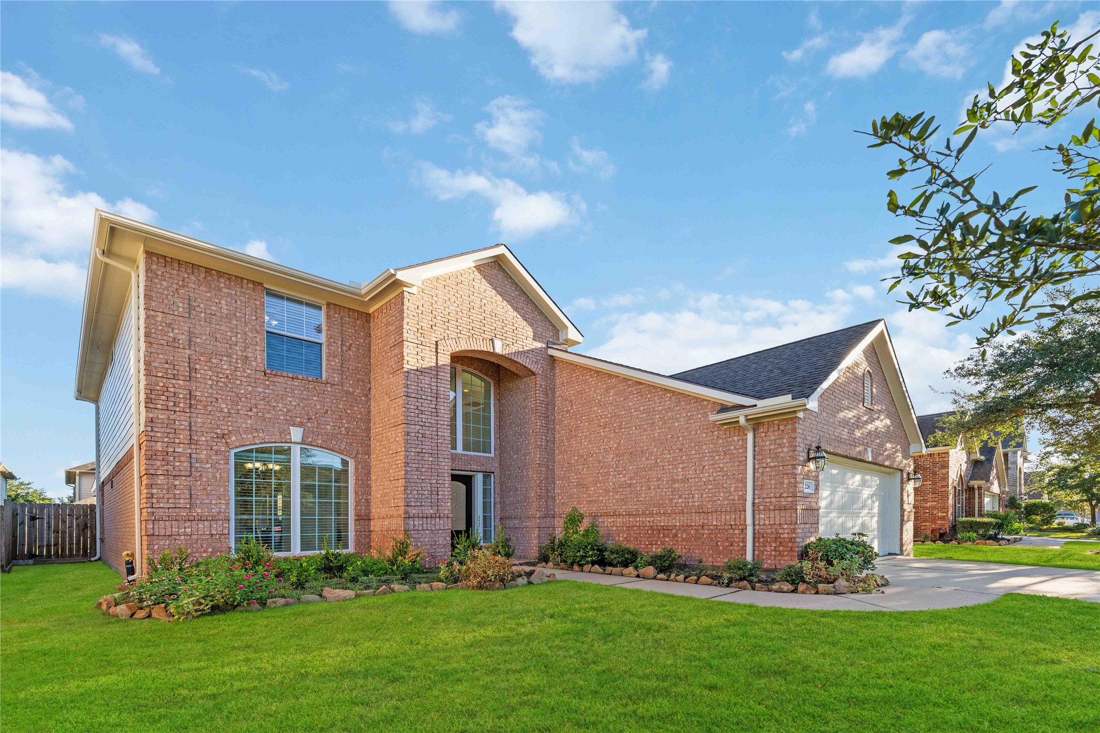 7226 VORGEN Court Spring, TX 77379 - Photo 15 of 43 a front view of a house with a garden