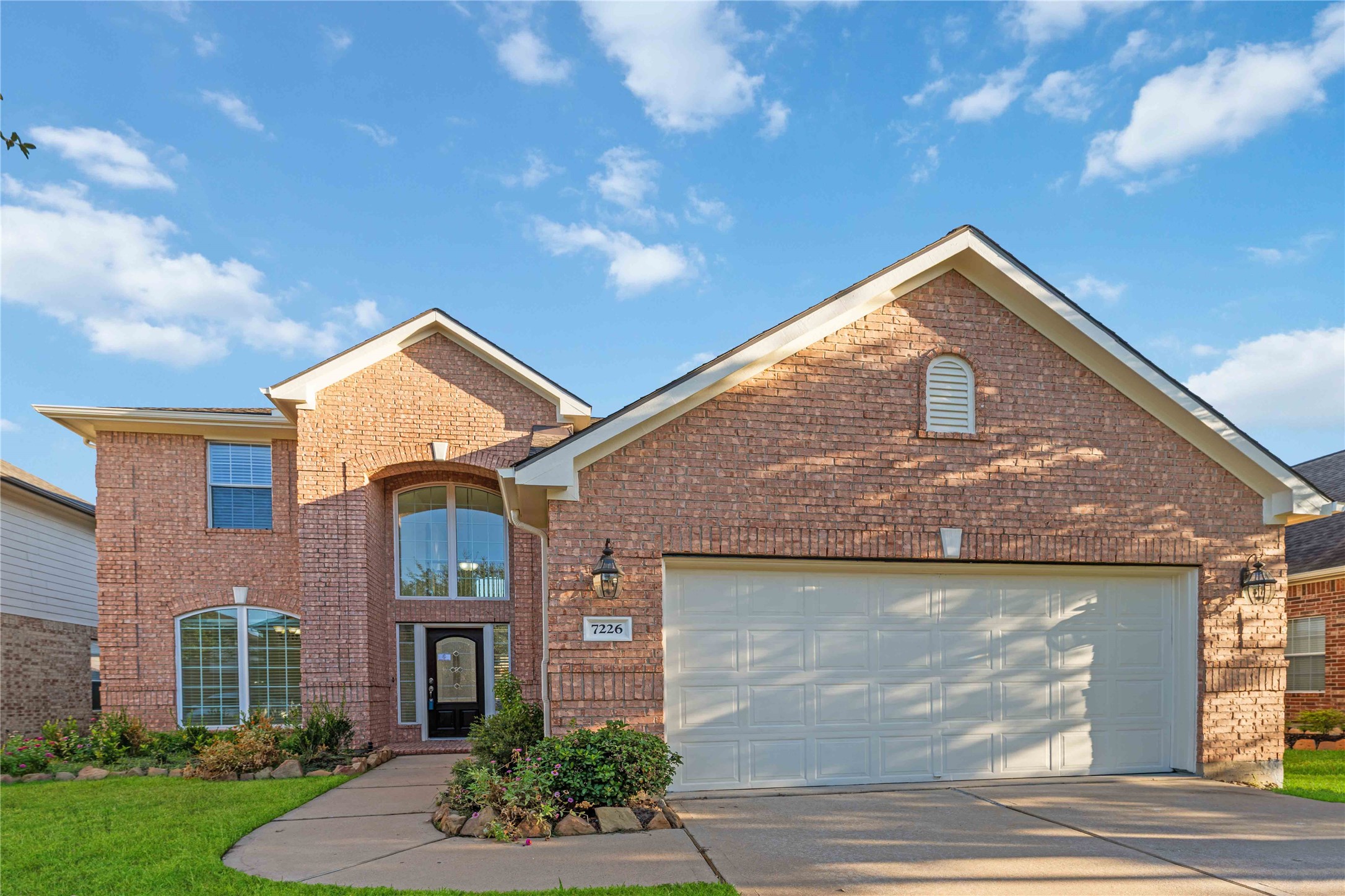 7226 VORGEN Court Spring, TX 77379 - Photo 2 of 43 a front view of a house with garden