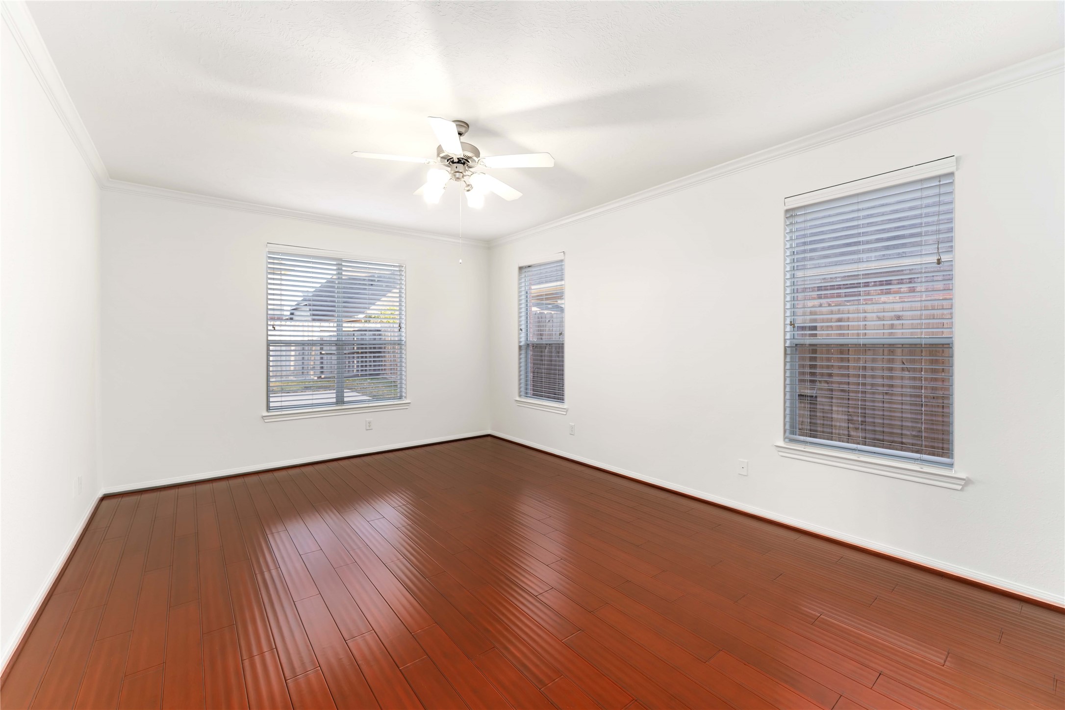 7226 VORGEN Court Spring, TX 77379 - Photo 22 of 43 a view of an empty room with wooden floor and a window