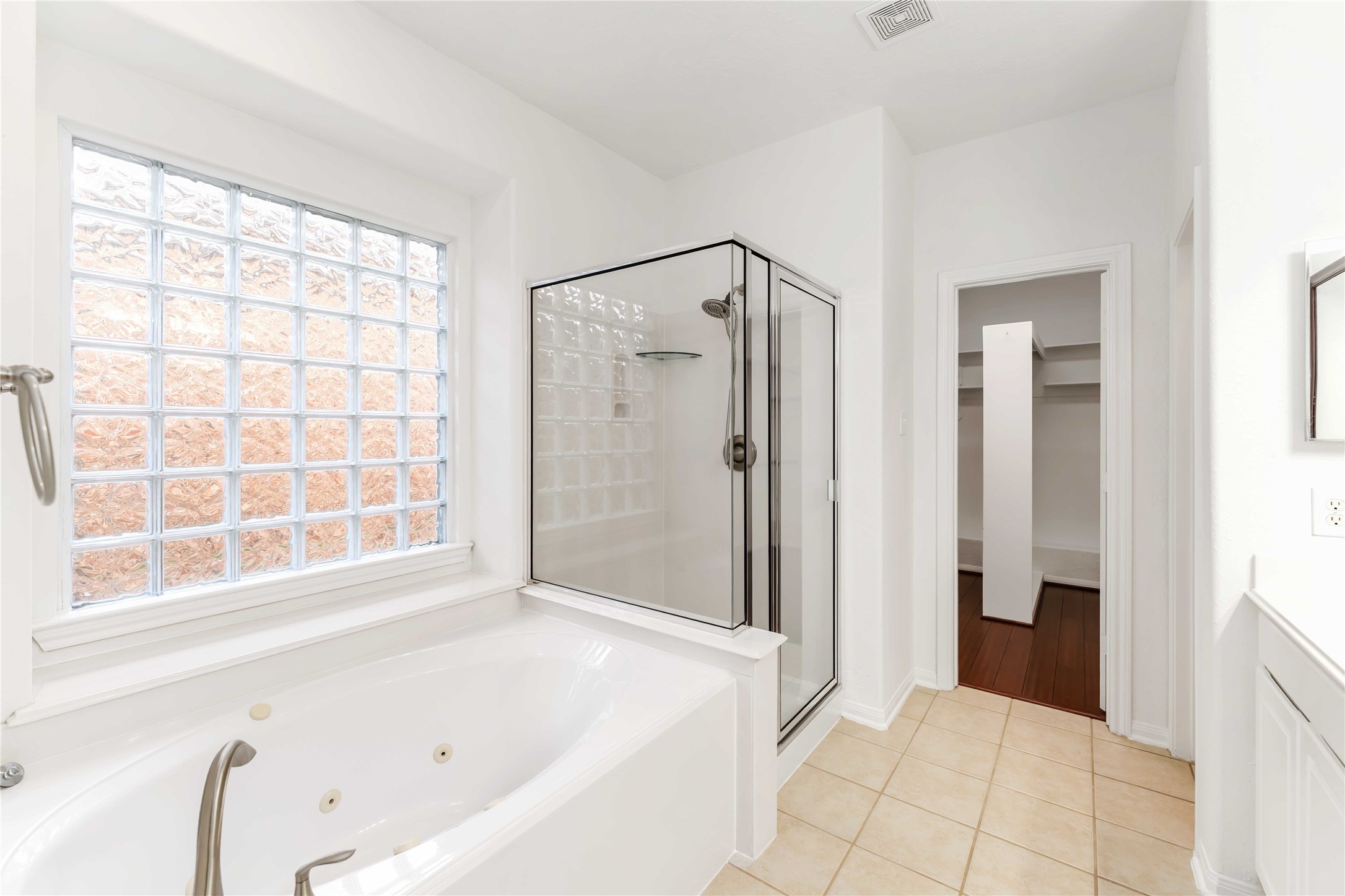7226 VORGEN Court Spring, TX 77379 - Photo 25 of 43 a bathroom with a bathtub and a shower