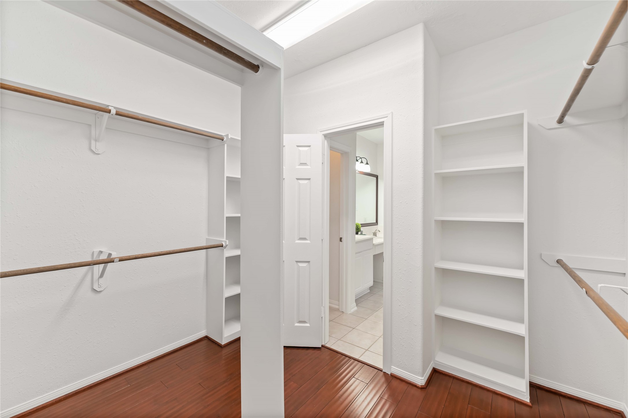 7226 VORGEN Court Spring, TX 77379 - Photo 26 of 43 a view of walk in closet with wooden floor
