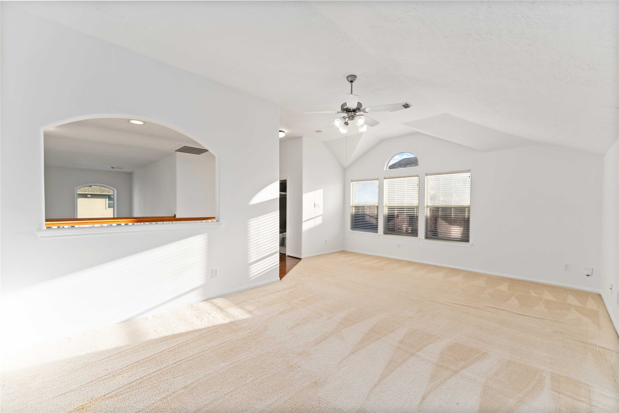 7226 VORGEN Court Spring, TX 77379 - Photo 28 of 43 a view of an empty room with a kitchen