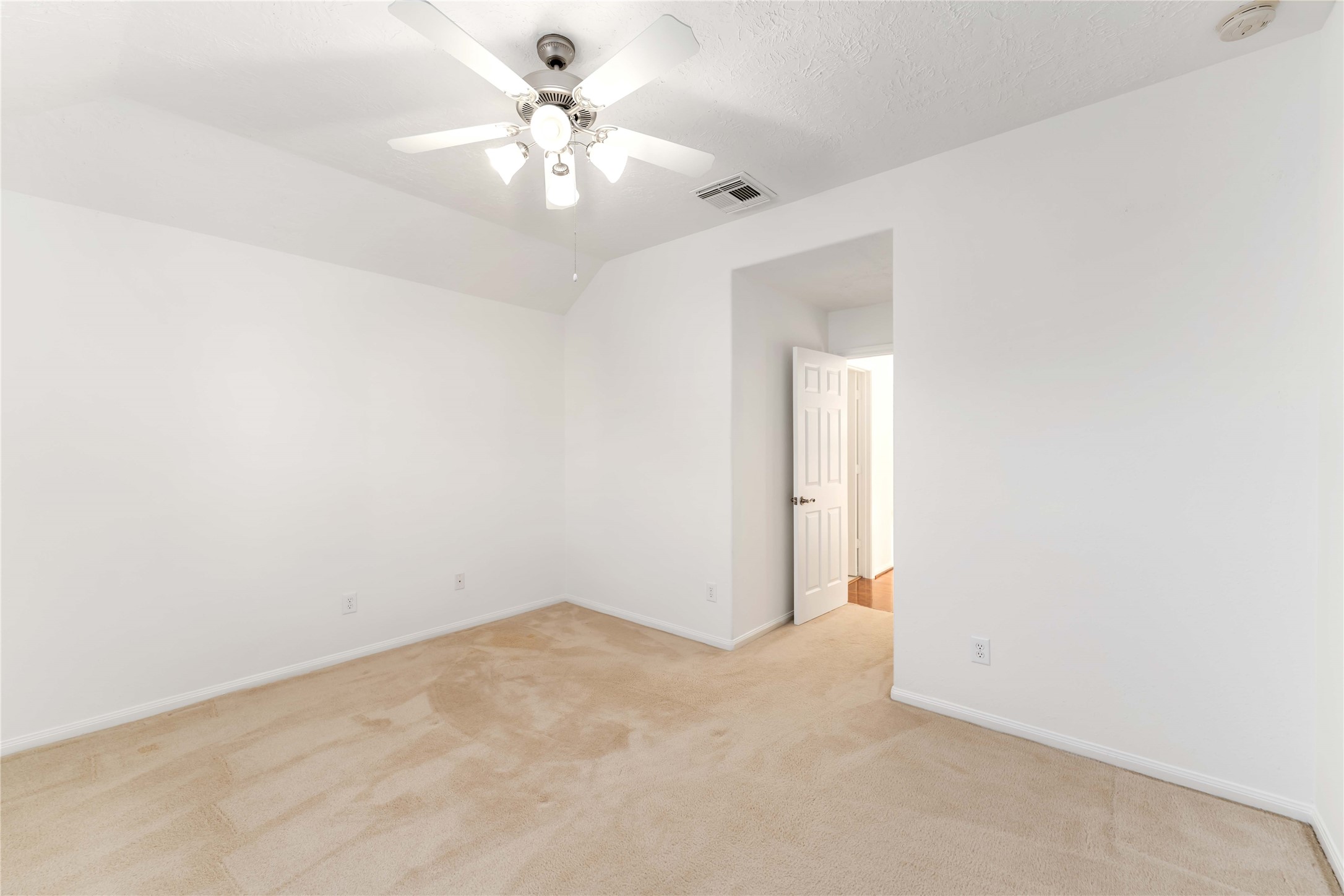 7226 VORGEN Court Spring, TX 77379 - Photo 33 of 43 an empty room with a chandelier fan and closet