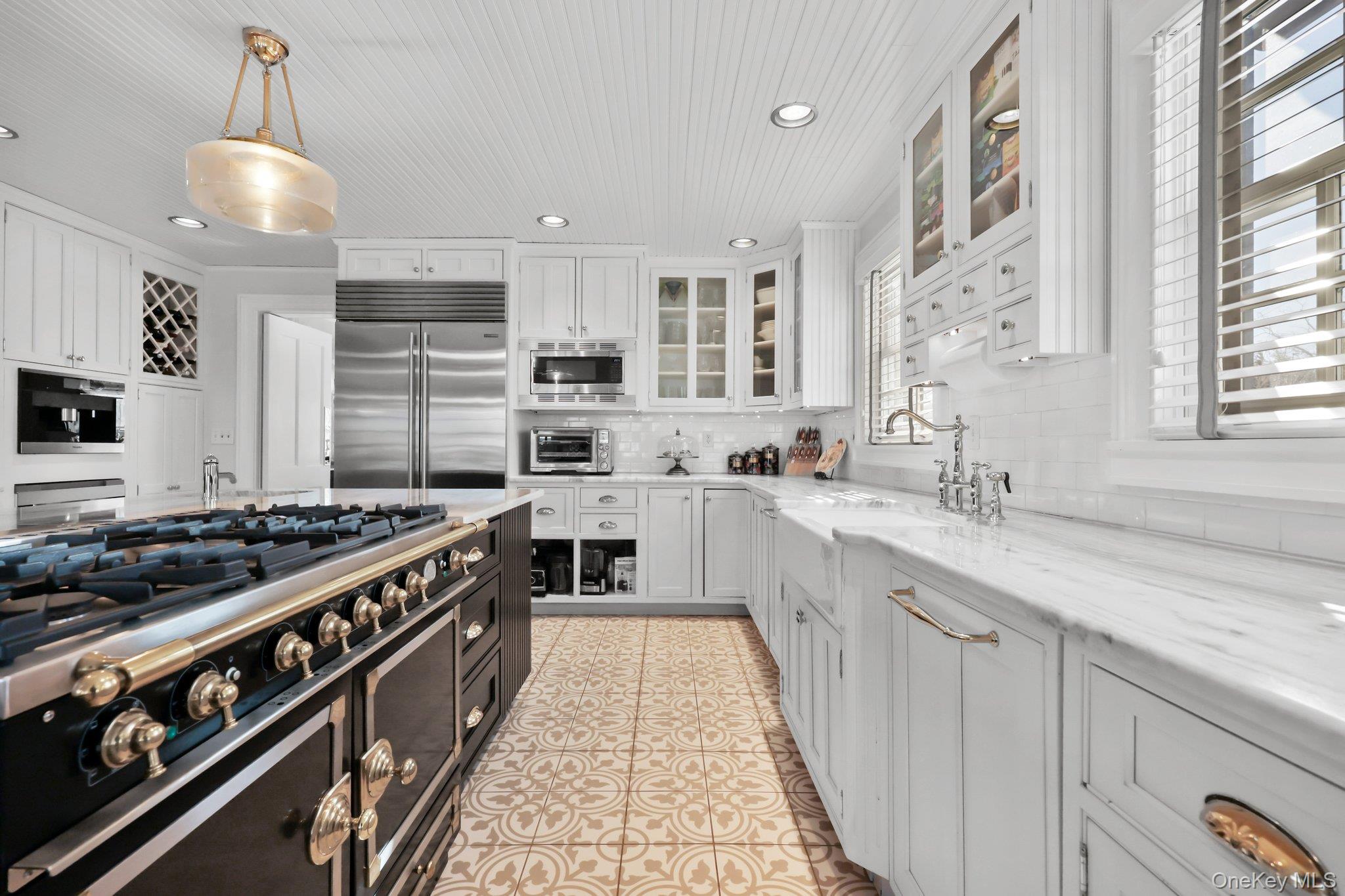 16 State School Road Warwick, NY 10990 - Photo 14 of 50 a kitchen with stainless steel appliances a sink stove and cabinets