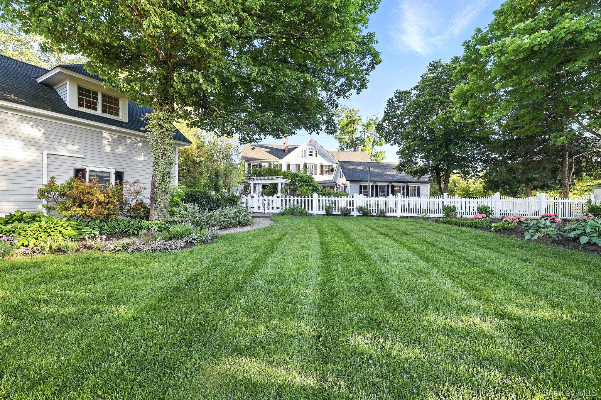 16 State School Road Warwick, NY 10990 - Photo 42 of 50 a front view of a house with a yard porch and sitting area
