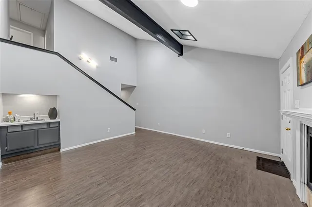 a view of a kitchen with a sink and a stove top oven