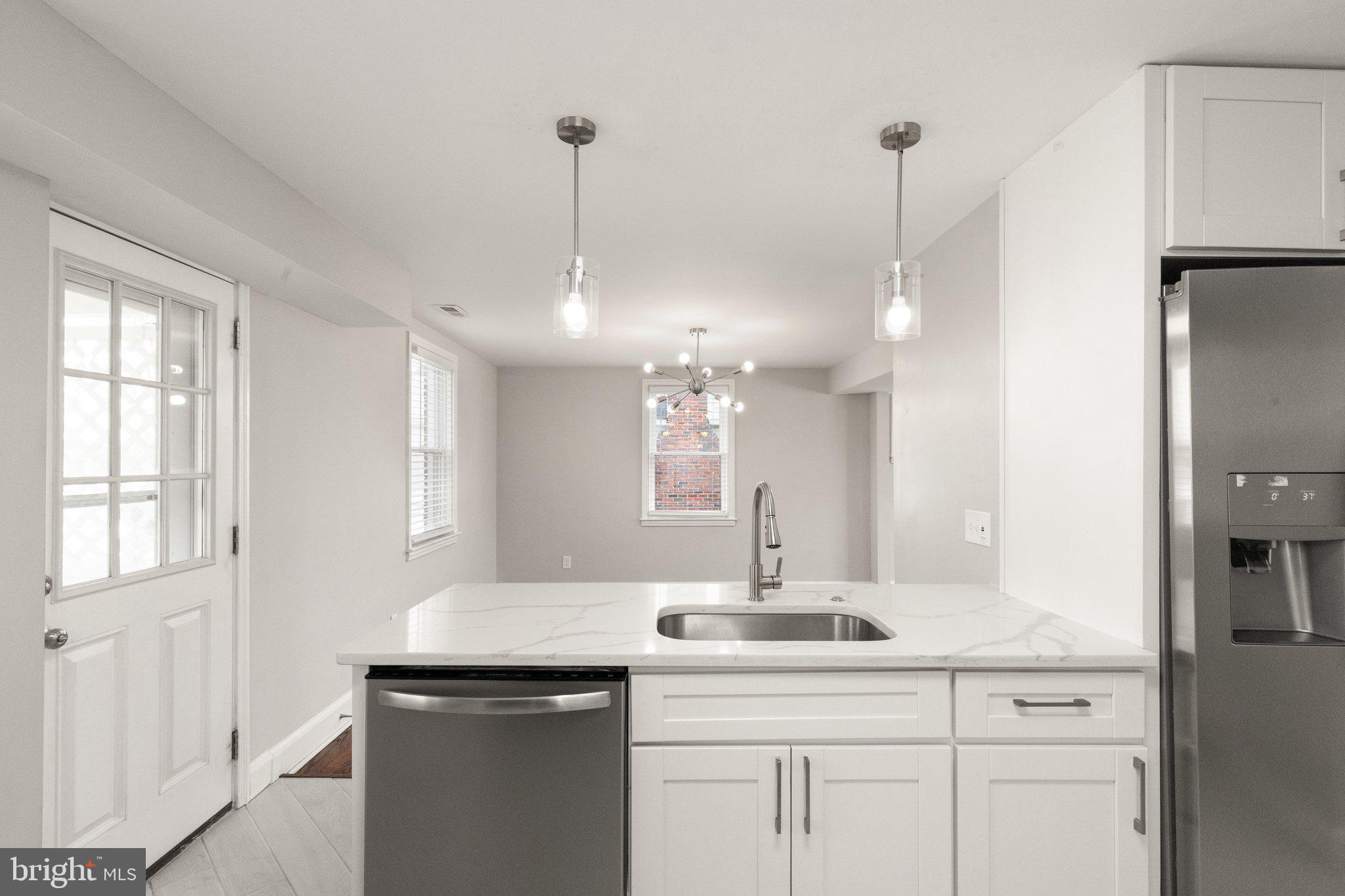 7512 Brightside Avenue Baltimore, MD 21237 - Photo 7 of 32 a bathroom with a sink and a mirror