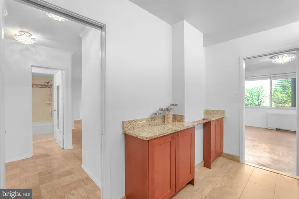 a bathroom with a shower sink and mirror