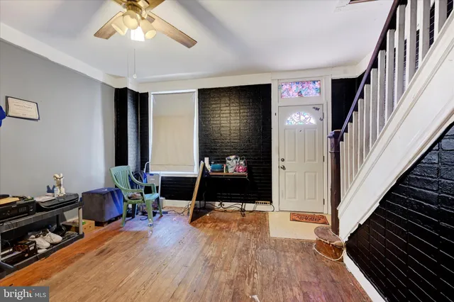 a view of a livingroom with furniture and an empty room