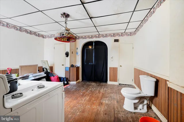 a workspace with furniture and wooden floor