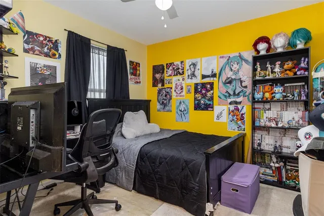 a bedroom with a bed and a dresser