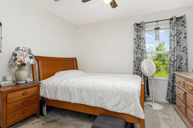 a bedroom with a bed and dresser