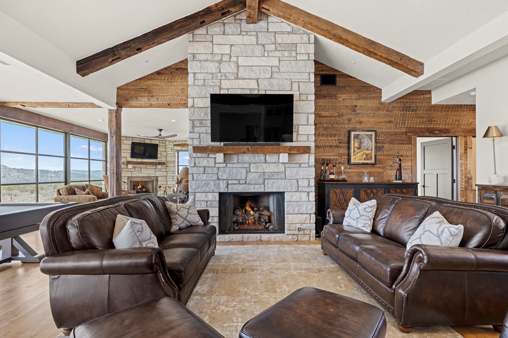 256 Persimmon Point Mason, TX 76856 - Photo 11 of 60 a living room with furniture a flat screen tv and a fireplace