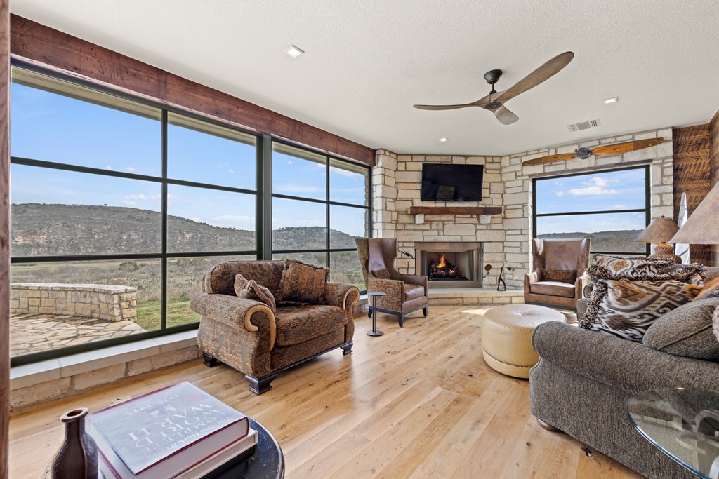 256 Persimmon Point Mason, TX 76856 - Photo 15 of 60 a living room with furniture fireplace and a flat screen tv