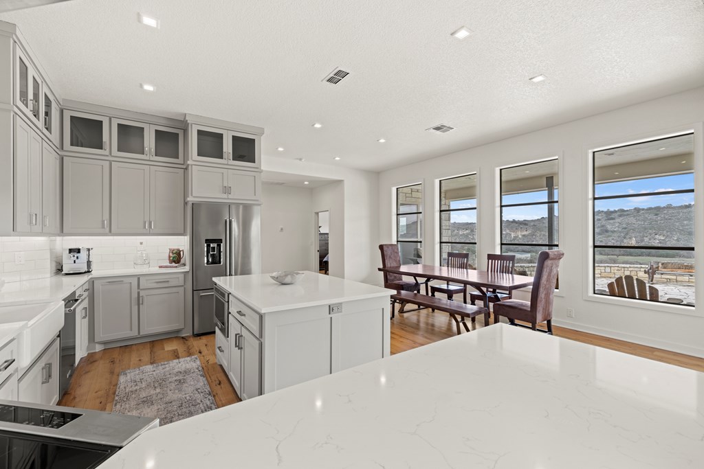 256 Persimmon Point Mason, TX 76856 - Photo 19 of 60 a large white kitchen with a large window