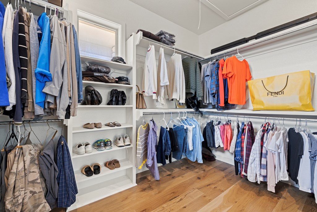 256 Persimmon Point Mason, TX 76856 - Photo 23 of 60 a view of walk in closet with clothes and shoes