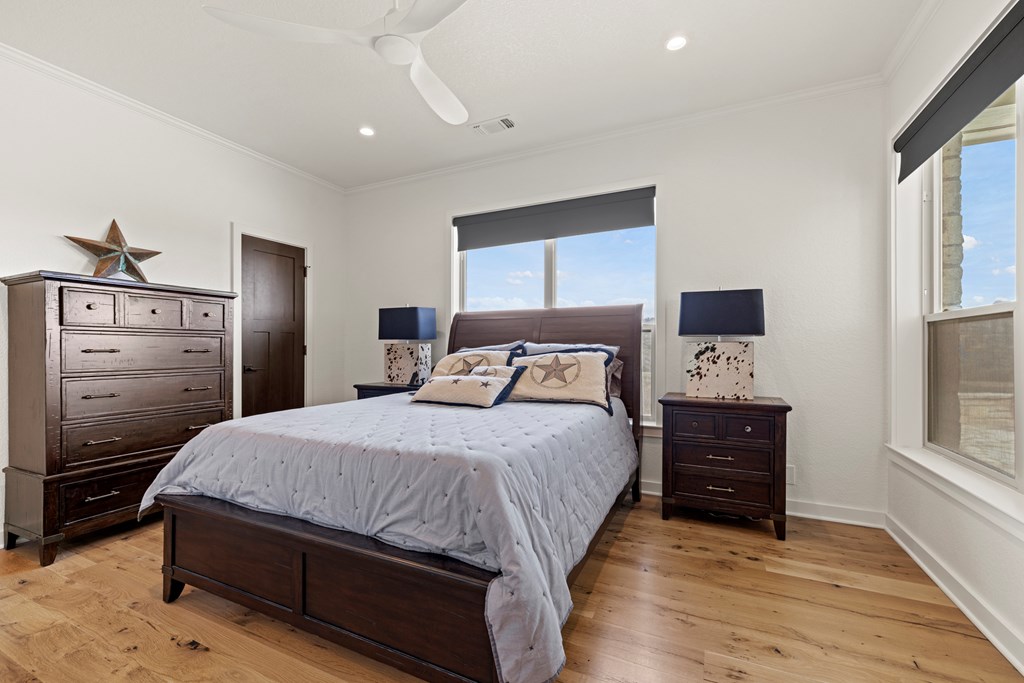 256 Persimmon Point Mason, TX 76856 - Photo 25 of 60 a bedroom with a bed and a dresser