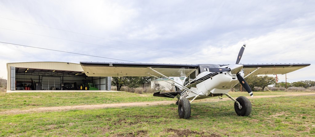 256 Persimmon Point Mason, TX 76856 - Photo 28 of 60 a swimming pool with outdoor seating and yard