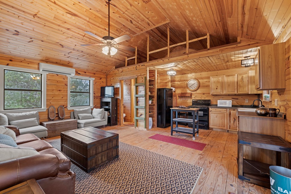 256 Persimmon Point Mason, TX 76856 - Photo 39 of 60 a living room with furniture a flat screen tv and a table